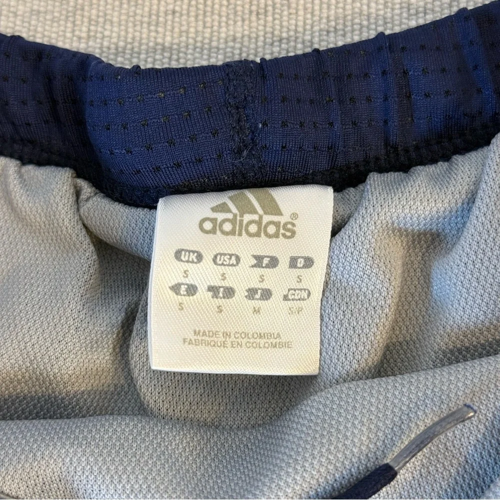 Adidas women's athletic climacool shorts size S. Navy blue with‎ purple stripes